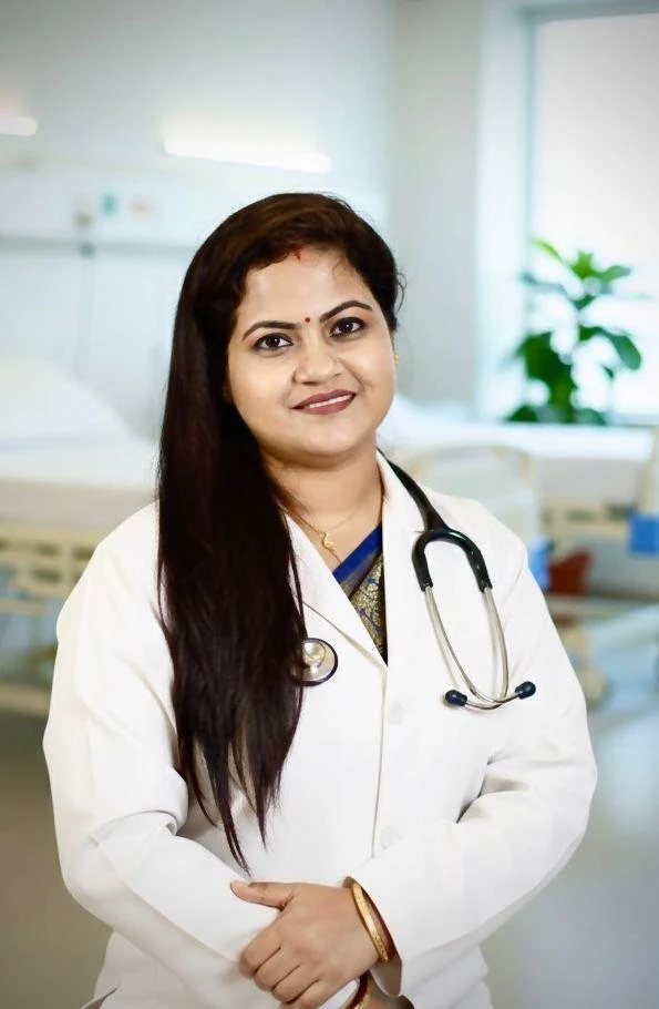 Dr. Binita Sarker Shanta in a white coat with a stethoscope